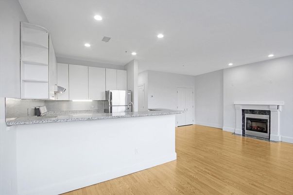 Empty room, Fireplace, Interior, Kitchen, Recessed Lighting, Wood Texture Flooring