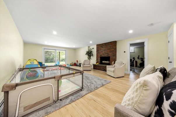 Billiard Table, Fireplace, Game Room, Interior, Living room, Recessed Lighting, Stone Walls, Wood Texture Flooring
