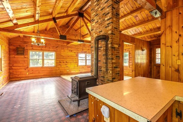 Empty room, Fireplace, Interior, Pendant Lights, Stone Walls, Wooden Beams, Wooden Ceilings, Wooden Walls