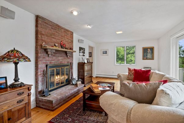 Fireplace, Interior, Living room, Recessed Lighting, Stone Walls, Wood Texture Flooring