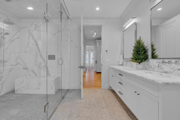 Bathroom, Dual Sink Vanities, Glass Shower, Interior, Marble Walls, Recessed Lighting, Wood Texture Flooring