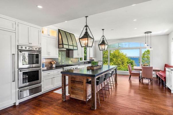 Dining room, Interior, Kitchen, Pendant Lights, Recessed Lighting, Stainless Steel Appliances, Water, Wood Texture Flooring