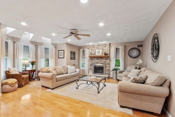 Fireplace, Interior, Living room, Recessed Lighting, Stone Walls, Wood Texture Flooring