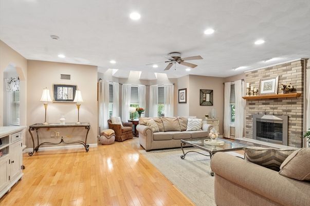 Fireplace, Interior, Living room, Recessed Lighting, Stone Walls, Wood Texture Flooring