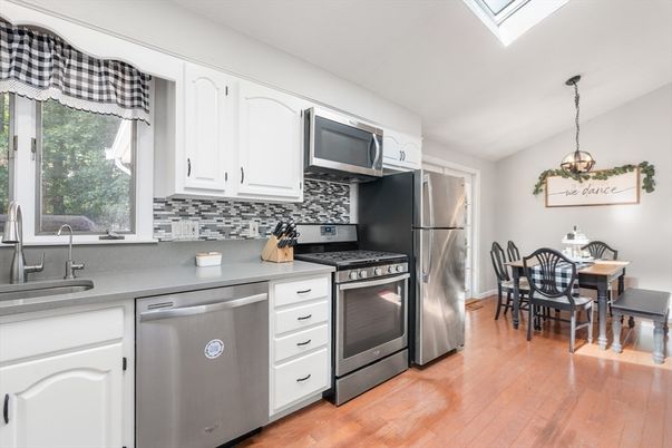 Dining room, Interior, Kitchen, Pendant Lights, Stainless Steel Appliances, Wood Texture Flooring
