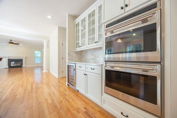 Fireplace, Interior, Kitchen, Recessed Lighting, Stainless Steel Appliances, Wood Texture Flooring