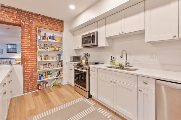 Interior, Kitchen, Recessed Lighting, Stainless Steel Appliances, Stone Walls, Wood Texture Flooring