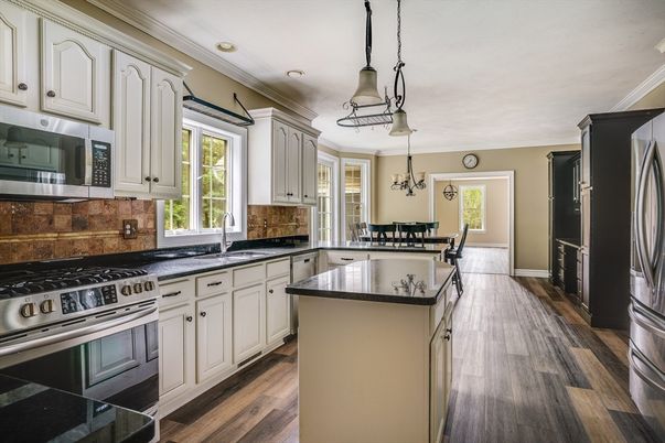 Chandelier, Dining room, Interior, Kitchen, Pendant Lights, Recessed Lighting, Stainless Steel Appliances, Wood Texture Flooring