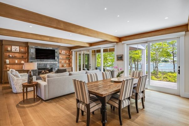 Dining room, Fireplace, Interior, Living room, Recessed Lighting, Water, Wooden Beams, Wood Texture Flooring
