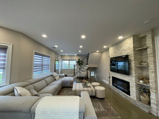 Fireplace, Interior, Living room, Recessed Lighting, Stone Walls, Wood Texture Flooring