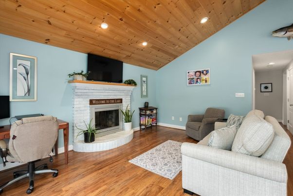 Fireplace, Home Office, Interior, Living room, Recessed Lighting, Wooden Ceilings, Wood Texture Flooring