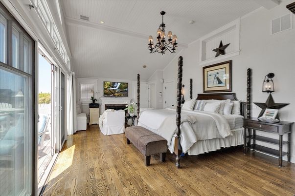Bedroom, Chandelier, Fireplace, Interior, Recessed Lighting, Wood Texture Flooring