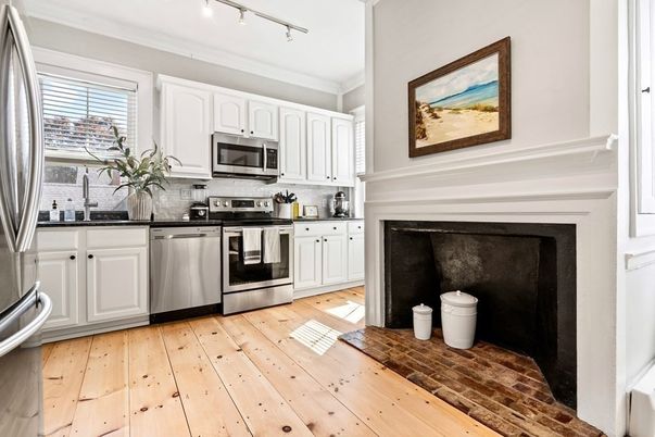 Fireplace, Interior, Kitchen, Stainless Steel Appliances, Wood Texture Flooring