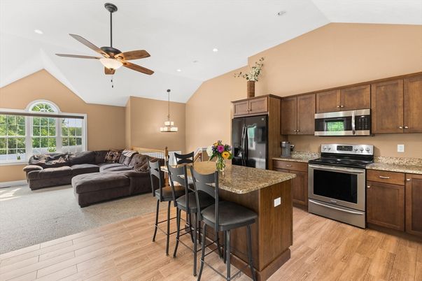 Chandelier, Dining room, Interior, Kitchen, Living room, Pendant Lights, Recessed Lighting, Stainless Steel Appliances, Wood Texture Flooring