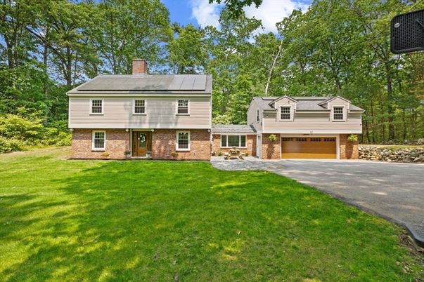 Attached, Backyard, Exterior, Facade, Brick Facade, Solar Panels, Raised Ranch