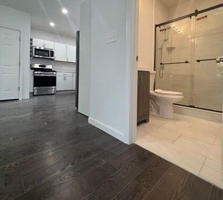 Bathroom, Glass Shower, Interior, Kitchen, Recessed Lighting, Stainless Steel Appliances, Wood Texture Flooring