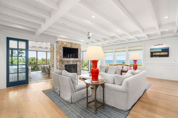 Fireplace, Interior, Living room, Recessed Lighting, Stone Walls, Water, Wood Texture Flooring