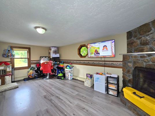 Fireplace, Fitness Equipment, Interior, Stone Walls, Wood Texture Flooring