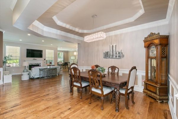 Dining room, Fireplace, Interior, Living room, Pendant Lights, Recessed Lighting, Wood Texture Flooring