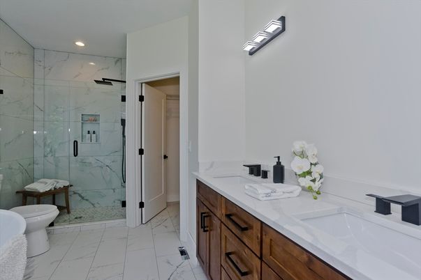 Bathroom, Dual Sink Vanities, Glass Shower, Interior, Marble, Marble Walls, Recessed Lighting
