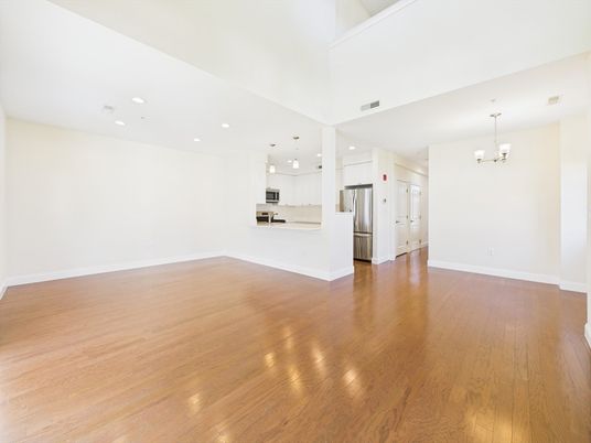 Chandelier, Empty room, Interior, Kitchen, Pendant Lights, Recessed Lighting, Stainless Steel Appliances, Wood Texture Flooring