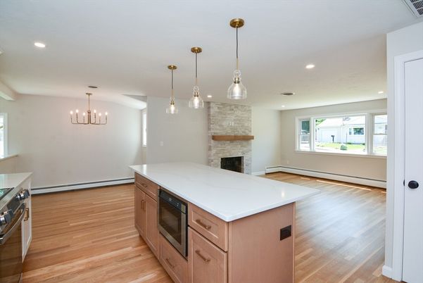 Empty room, Fireplace, Interior, Kitchen, Pendant Lights, Recessed Lighting, Wood Texture Flooring