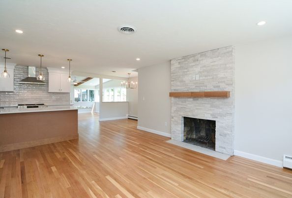 Empty room, Fireplace, Interior, Kitchen, Pendant Lights, Recessed Lighting, Stone Walls, Wood Texture Flooring