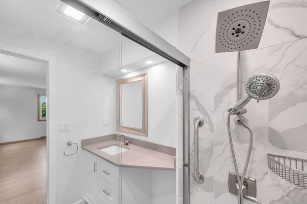 Bathroom, Glass Shower, Interior, Marble Walls, Recessed Lighting, Wood Texture Flooring