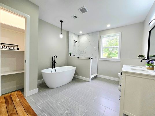 Bathroom, Dual Sink Vanities, Free Standing Baths, Interior, Marble Walls, Pendant Lights, Recessed Lighting