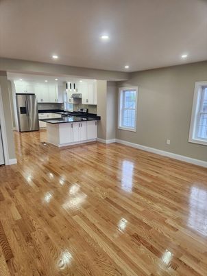 Empty room, Interior, Kitchen, Recessed Lighting, Stainless Steel Appliances, Wood Texture Flooring