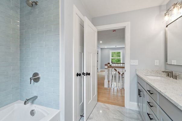 Bathroom, Dual Sink Vanities, Interior, Marble, Recessed Lighting, Wood Texture Flooring