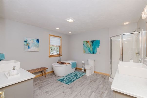 Bathroom, Free Standing Baths, Glass Shower, Interior, Recessed Lighting, Wood Texture Flooring