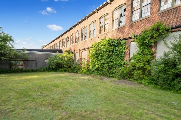 Backyard, Exterior, Facade, Brick Facade, Condo Building