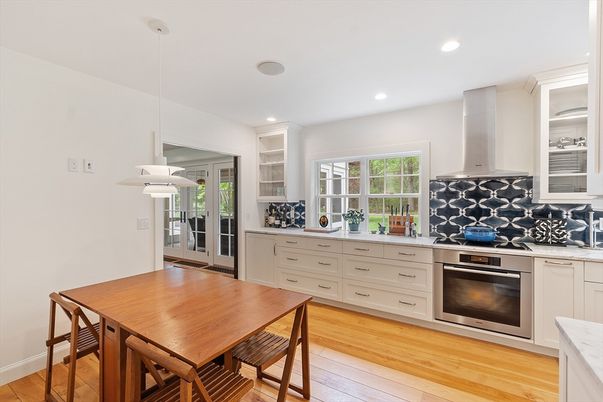 Dining room, Interior, Kitchen, Pendant Lights, Recessed Lighting, Stainless Steel Appliances, Wood Texture Flooring