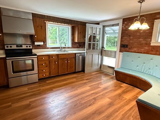 Interior, Kitchen, Pendant Lights, Stainless Steel Appliances, Stone Walls, Wood Texture Flooring