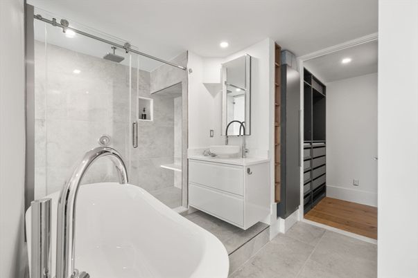 Bathroom, Dual Sink Vanities, Free Standing Baths, Glass Shower, Interior, Recessed Lighting, Wood Texture Flooring