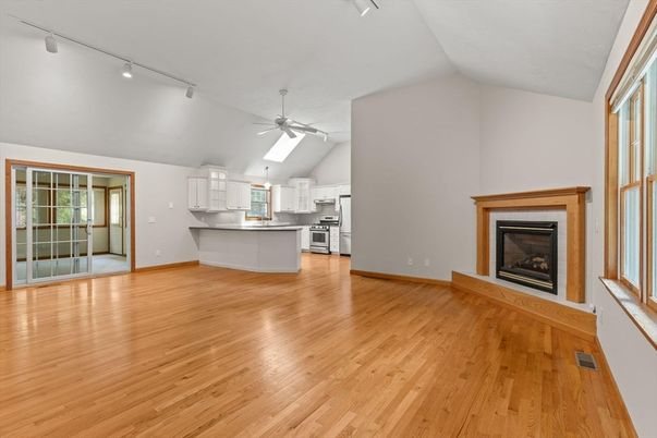 Empty room, Fireplace, Interior, Kitchen, Stainless Steel Appliances, Wood Texture Flooring