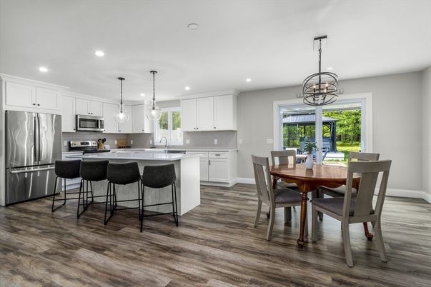 Dining room, Interior, Kitchen, Pendant Lights, Recessed Lighting, Stainless Steel Appliances, Wood Texture Flooring