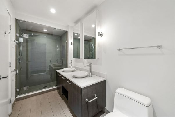 Bathroom, Dual Sink Vanities, Glass Shower, Interior, Recessed Lighting, Wood Texture Flooring