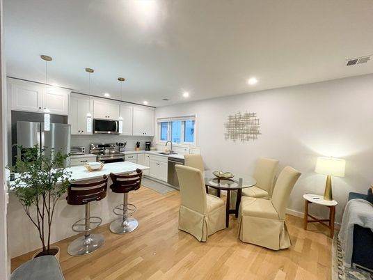 Dining room, Interior, Kitchen, Pendant Lights, Recessed Lighting, Stainless Steel Appliances, Wood Texture Flooring