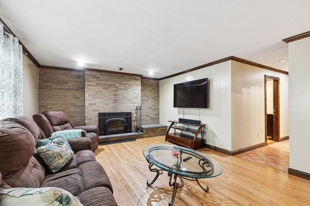 Fireplace, Interior, Living room, Recessed Lighting, Stone Walls, Wood Texture Flooring