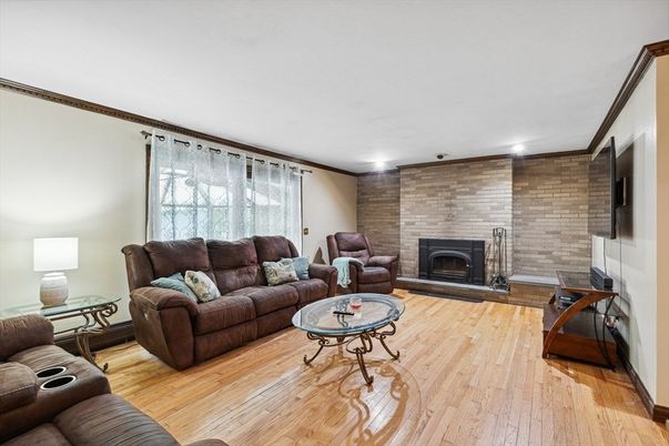 Fireplace, Interior, Living room, Recessed Lighting, Stone Walls, Wood Texture Flooring