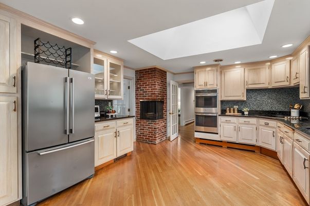Fireplace, Interior, Kitchen, Recessed Lighting, Stainless Steel Appliances, Stone Walls, Wood Texture Flooring