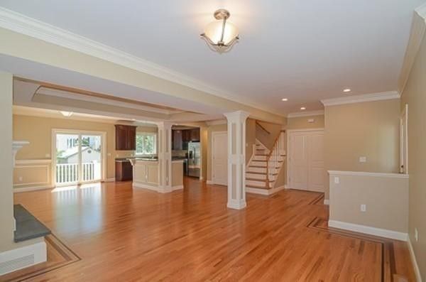 Empty room, Interior, Kitchen, Recessed Lighting, Stainless Steel Appliances, Wood Texture Flooring