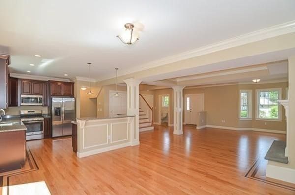 Empty room, Interior, Kitchen, Pendant Lights, Recessed Lighting, Stainless Steel Appliances, Wood Texture Flooring