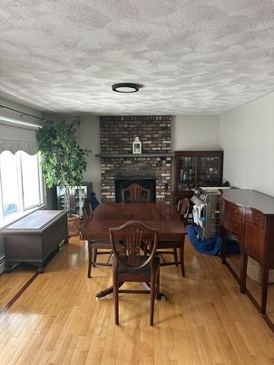 Dining room, Fireplace, Interior, Stone Walls, Wood Texture Flooring