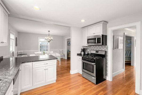 Chandelier, Dining room, Interior, Kitchen, Recessed Lighting, Stainless Steel Appliances, Wood Texture Flooring