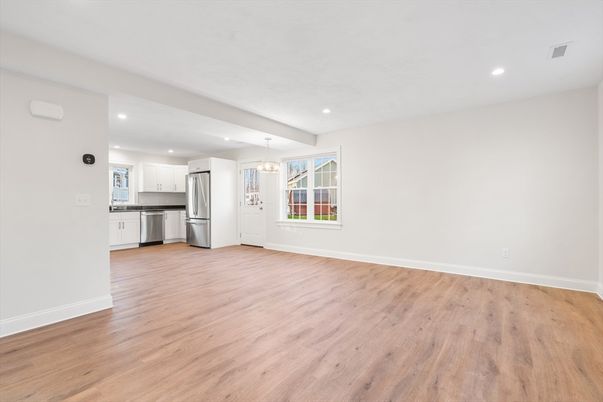 Empty room, Interior, Kitchen, Pendant Lights, Recessed Lighting, Stainless Steel Appliances, Wood Texture Flooring