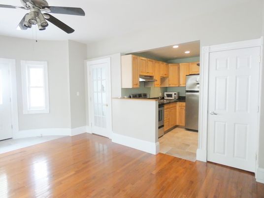 Empty room, Interior, Kitchen, Recessed Lighting, Stainless Steel Appliances, Wood Texture Flooring