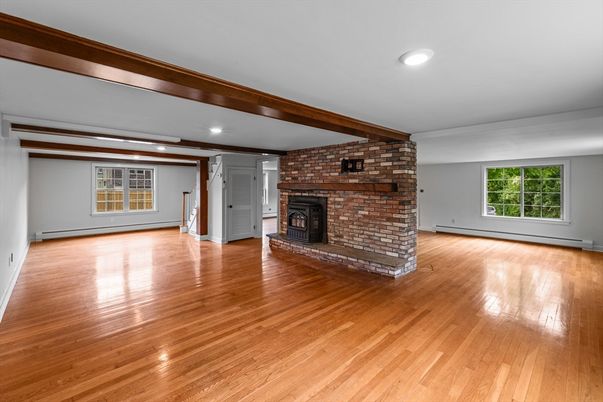 Empty room, Fireplace, Interior, Recessed Lighting, Stone Walls, Wood Texture Flooring